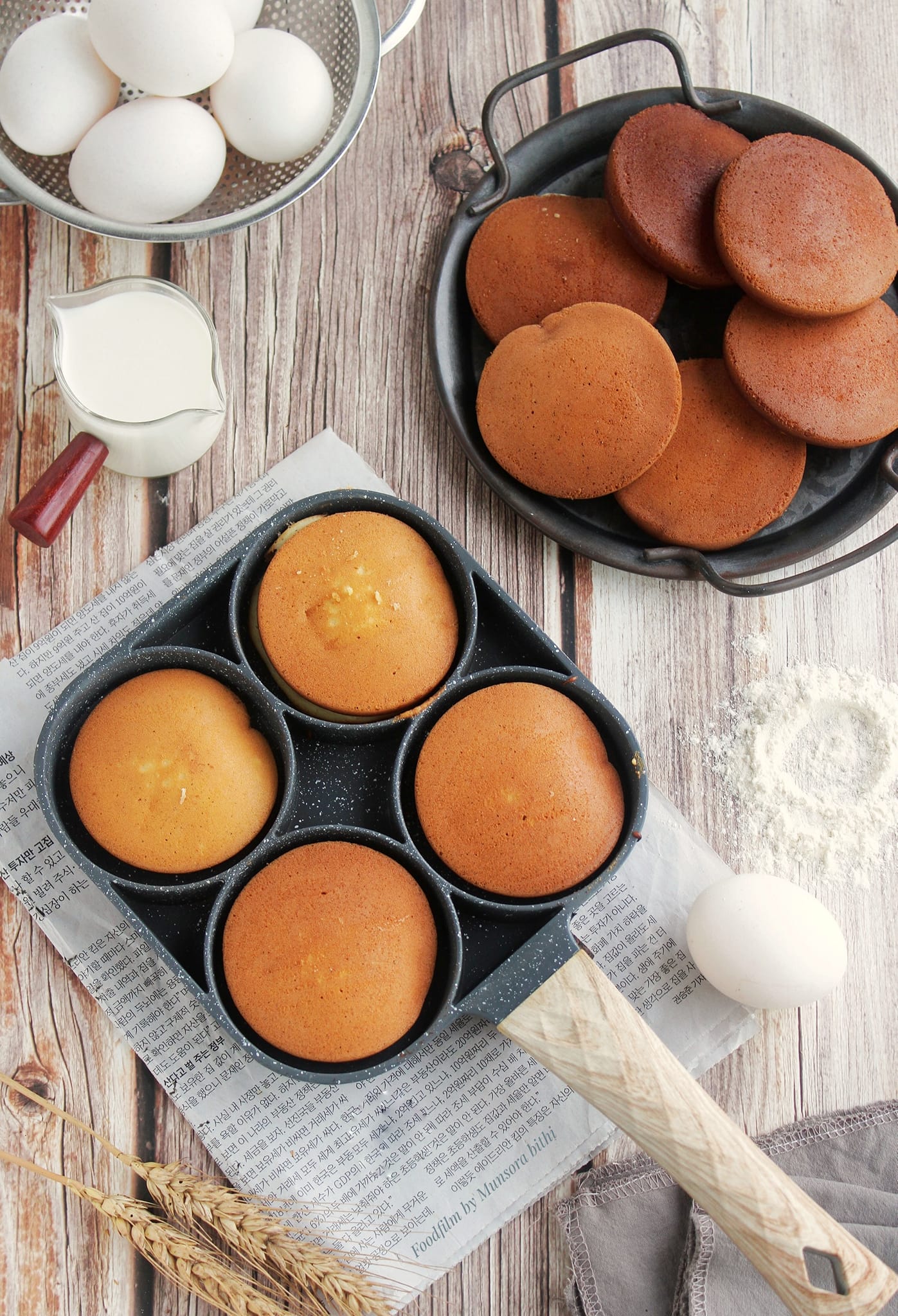 Mini pancakes on the table with some eggs